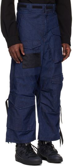 Non-stretch chambray jeans. Flap pockets throughout. · Paneled construction · Belt loops · Velcro detailing at waistband · Zip-fly · Mesh pocket at front and back leg · Tucks at knees · Two-way zip detailing at outseams · Bonded nylon taffeta lining Part of the Junya Watanabe MAN collection. Supplier color: Indigo Urban Style Dark Wash Cargo Pants With Belt Loops, Urban Denim Blue Pants With Belt Loops, Urban Style Dark Wash Cargo Pants, Utility Dark Wash Pants With Pockets, Utility Pants With Pockets In Dark Wash, Denim Blue Pants With Patch Pockets In Rigid Denim, Dark Wash Utility Pants With Pockets, Utility Denim Pants With Hip Pockets, Urban Dark Wash Pants With Belt Loops