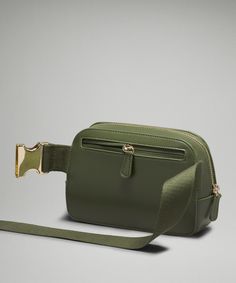 Phone, Keys, Wallet. Keep Them Close In This Special Version Of Our Versatile Belt Bag Designed In A Beautiful Leather-Like Material, Partially Made From Cactus. Designed For Casual. Bag Dimensions: 19Cm X 5.5Cm X 13Cm (7.5" X 2" X 5"):strap Length When Fully Extended: 106Cm (41.7"):volume: 1L. Exterior Zippered Pocket To Secure Your Valuables. Interior Pockets Hold The Essentials. Once You Find Your Perfect Fit, Tuck The Excess Belt Bag Strap Into The Elastic Loops. Belt Bags, the best stocking Lululemon Everywhere Belt Bag, Everywhere Belt Bag, Functional Accessories, Bags Purses, Green Gold, Bag Straps, Belt Bag, Green And Gold, Purse Wallet