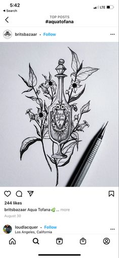 a drawing of a coat of arms with flowers and leaves on it, next to a pen