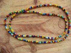 Colorful Long Beaded Necklace, Multicolor Seed Bead Necklace, Colorful Bead Necklace, Love Beads, Hippie Necklace, Boho Necklace, Men's Bead Necklace, Multicolor Beaded Necklace, Long Beaded Necklace, African Trade Bead Style Beads This super colorful necklace is made with a mix of size 8/0 and 6/0 seed beads. Some are African Trade Bead style beads. There is no clasp and it is strung on strong waterproof braided nylon. If you would like a different size then listed or would like it to have a clasp you can send me a message. I have a similar necklace with smaller beads -- check it out at https://shimmersnecklaceshop.etsy.com Multicolor Heart Beaded Necklaces With Round Beads, Multicolor Heart Beads For Festival, Multicolor Heart Beads For Festivals, Rainbow Heart Shaped Beads, Rainbow Heart-shaped Beads, Rainbow Beaded Necklace With Heart Beads, Rainbow Heart Beads Necklace, Tiffany T, Mens Beaded Necklaces