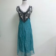 New Trelise Cooper New Zealand Dress..Size 6 ..Turquoise Blue With Black Bodice..Beaded With Pearls Sequins ..Silver Floral Embroidery...Silk Organza Sheer Layer Over Lining..Side Zip.. New Without Tags Length 39(Slip) , 42 Sheer Over Layer Bust 34 Waist 30 Hips 37 Turquoise Dresses With Resham Embroidery, Cooper Dress, Embroidered Silk Dresses, Trelise Cooper, Silk Organza, Embroidered Silk, Black Beads, Turquoise Blue, Silk Dress