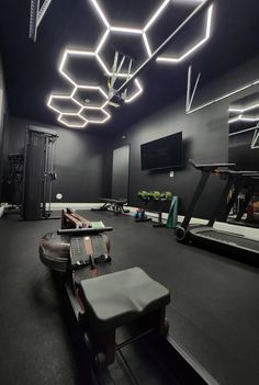 an empty gym room with treadmills and exercise equipment