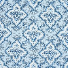 a blue and white background with an intricate design