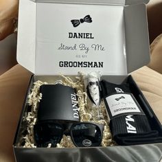 the groomsmen gift box is filled with personal items for his special day,