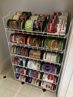 an organized spice rack in the corner of a kitchen