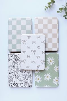 four coasters with flowers and bows on them, all in different colors from green to white