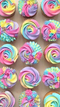 the cupcakes are decorated with colorful icing