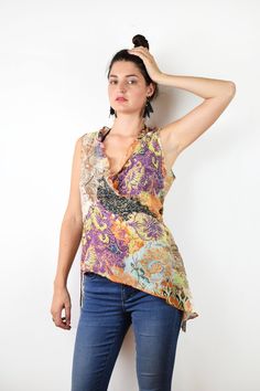 Floral asymmetrical blouse In great condition Tag: Labod Material: 68% cotton, 32% silk Size: Eu 42, medium, large bust 41 cm = 16 in length 56 cm = 22 in waist 40 cm =15,5 in Thank you for your visit! View more products: https://www.etsy.com/shop/VintageSeventhHeaven Feel free to contact me if you have any questions. Sleeveless Orange Cotton Blouse, Fitted Multicolor Asymmetrical Top, Multicolor Asymmetrical Hem Tops For Summer, Sleeveless Purple Cotton Blouse, Purple Cotton Sleeveless Blouse, Bohemian Blouse With Asymmetrical Hem For Summer, Purple Sleeveless Bohemian Tops, Bohemian Summer Tops With Asymmetrical Hem, Bohemian Tops With Asymmetrical Hem For Summer