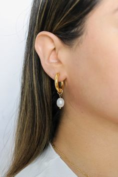 Elevate your earring game with our Ana Pearl Drop Earrings, the ideal addition to create a stunning earring stack with our collection of dainty earrings. These versatile earrings add a touch of elegance and charm, making them the perfect addition to your earring collection! All of our jewelry comes with a free jewelry pouch and cloth to keep your pretties safe and clean. Details Color: 18K Gold PlatedMaterial: Stainless Steel Size: 4cm Care Guide Store in a dry, cool place away from sunlight i.e Earring Stack, Earring Collection, Charm Making, Stunning Earrings, Dainty Earrings, Earrings Collection, Pearl Drop Earrings, Pearl Drop, Jewelry Pouch