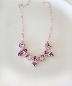 Gorgeous necklace done with crystals in a light mauve color. The crystals alternate 8mm round and 15x7mm marquise. Shown in the rose gold metal finish. 18 inches long. Thanks for stopping by! Bridesmaids Accessories, Light Mauve, Purple Mauve, Wedding Day Jewelry, Necklace Bridal, Bridesmaid Accessories, Swarovski Necklace, Cluster Necklace, Necklace Wedding