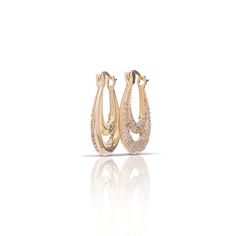 Made to add a little interest to your ears. Perfect alone or the Valley Hoops pair together beautifully with any piece in your collection. Dainty in design these 14kt Gold Plated with genuine CZ accents hang approximately 1” and totally work well styled with both the CZs forward facing on full display or giving just a glimpse of glam. FINAL SALE Elegant Hoop Earrings With Cubic Zirconia, Elegant Hoop Earrings In Cubic Zirconia, Elegant Yellow Gold Cubic Zirconia Earrings, Gold Oval Cubic Zirconia Earrings, Gold Oval Earrings With Cubic Zirconia, Elegant Huggie Earrings With Sparkling Stones, Elegant Cubic Zirconia Huggie Earrings, Gold Elegant Cubic Zirconia Diamond Earrings, Elegant 14k Gold Earrings With Sparkling Stones