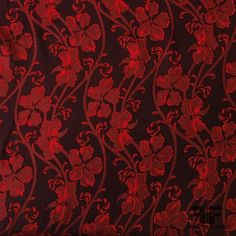 a red and black background with flowers on it