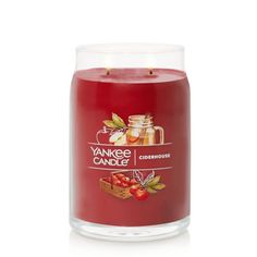 yankee candle with apples and cinnamons on the inside, in a clear glass container