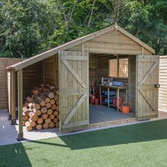 a wooden shed with logs stacked in the front and side doors open to reveal it's storage area