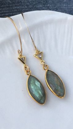 These beautiful labradorite earrings will go with everything. Gold Labradorite Earrings With Natural Stones, Gold Labradorite Drop Earrings, Handmade Gold Labradorite Earrings, Gold Labradorite Jewelry With Gemstone Accents, Dainty Gold Earrings With Gemstone Accents, Labradorite Drop Earrings With Natural Stones, Elegant Labradorite Drop Earrings, Elegant Labradorite Teardrop Earrings, Elegant Teardrop Labradorite Earrings