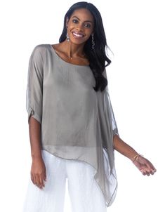 The Martina blouse features elegant silk layers and an asymmetrical hemline, perfectly suited with jeans or pants for an effortless, feminine look. Classic fit—one size fits most Boat neck, three-quarter length sleeves with banded cuffs, asymmetrical silk overlay 100% silk, viscose lining Hand wash, lay flat or hang to dry Made in Italy Elegant Spring Blouse With Overlay, Asymmetrical Viscose Top For Spring, Spring Versatile Blouse With Asymmetrical Hem, Versatile Asymmetrical Hem Blouse For Spring, Elegant Spring Blouse With Asymmetrical Hem, Spring Lagenlook Blouse For Layering, Spring Blouse With Asymmetrical Hem, Spring Asymmetrical Silk Blouse, Flowy Spring Blouse With Asymmetrical Hem