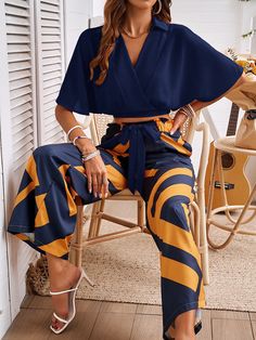 Introducing our Stay With Me Relaxed Matching Sets, perfect for on-the-go comfort with a playful twist. This 2-piece set features a crop top with an abstract print and wide leg pants, keeping you chic and comfy all day. Stay with this set for endless style and laughs (and maybe some naps too)! Size Guide: Model is 5’6” tall, and has a 33.2” bust, 26.4” waist, & 35.2” hips. She is wearing a S / US 4 / AU 8. This matching set is true to size. Material: 100% Polyester. Feature: V-neckline. Short sleeves. Wide leg pants. Wrap cropped top. Relaxed fit. (1 pcs crop top + 1 pcs pants, 2 pcs in total) Care Instructions: Machine wash / Cold hand wash Matching Pants And Top Set, Pants And Top Set, Stay With Me, Wrap Crop Tops, Matching Pants, If I Stay, Daily Dress, Affordable Clothes, Abstract Print