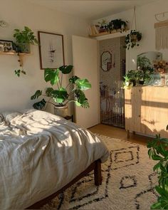 a bedroom with lots of plants on the wall