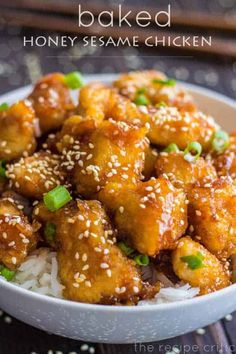 chicken with sesame seeds and green onions on a plate