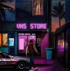 a man is walking down the street in front of a store with neon lights and palm trees