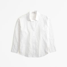 Elevate your wardrobe with the Abercrombie & Fitch Women's Oversized Embroidered Shirt, a perfect blend of comfort and chic style. This white button-up shirt is designed for the modern woman, featuring a relaxed, drop-shoulder silhouette that ensures ease of movement and a flattering fit.

- **Size**: Small
- **Color**: White
- **Material**: Body - Cotton; Embroidery - Polyester
- **Gender**: Female
- **Features**: All-over embroidered eyelet details, classic collar, button-up front, curved hem Oversized Poplin Shirt, Button Up Shirt Womens, Comfy Shirts, Cotton Embroidery, Suits Coats, Low Iron, Poplin Shirt, Embroidered Shirt, Oversized Shirt