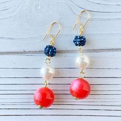 Triple bead drop earrings in red white and blue. A show-stopping set of sparkling patriotic earrings perfect to complete your red and white and blue style on Memorial Day, 4th of July, Veteran's Day, Flag Day or any other day! Thanks for looking! Patriotic Drop Earrings For 4th Of July, Patriotic Multicolor Dangle Jewelry, Patriotic Blue Beaded Earrings, Patriotic Blue Dangle Jewelry, Red Dangle Earrings For 4th Of July, Red Dangle Jewelry For 4th Of July, Patriotic Blue Drop Earrings, Beaded Earrings For 4th Of July Gift, Blue Patriotic Drop Earrings