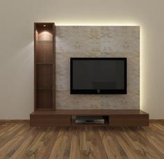 an empty living room with a flat screen tv on the wall and wood flooring