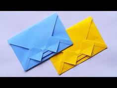 two origami envelopes sitting next to each other