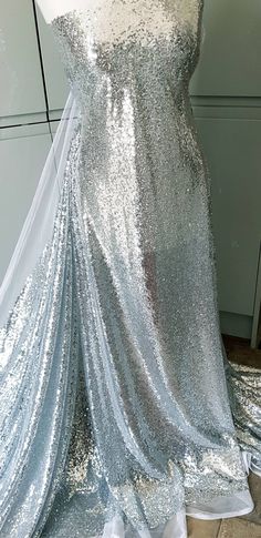 a dress made out of silver sequins