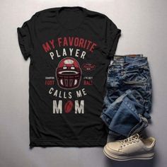 Men's Football Mom T Shirt My Favorite Player Calls Me Graphic Tee Football Shirts Mom Gift Idea Barkingtees Fashion available in T-shirt, hoodie, tank top, longsleeve, multi color and size S M L XL XXL 3XL 4XL 5XL. Shipping from the US. Easy 30 day return policy - Shop now! 6.1-ounce, 100% cotton .Double-needle neck, sleeves and hem; Roomy Unisex Fit. Ash is 99% cotton, 1% poly; Sport Grey is 90% cotton, 10% poly; Dark Heather is 50% cotton, 50% polyester .Decoration type: Digital Print. Made b Mom Pride, Football Mom Shirts, Call My Mom, Hoodie Size Chart, Cotton Gifts, Football Mom, Womens Size Chart, Mens Shirt Dress, Football Shirts