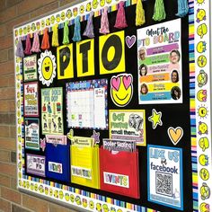 a bulletin board is decorated with colorful papers and tassels for the school's class