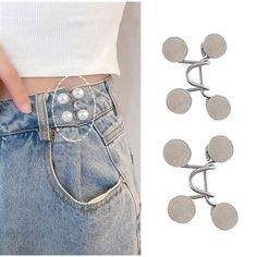 three pairs of buttons attached to the back of a pair of jeans