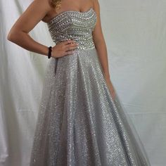 Stunning Silver Dress By Alexia. Size 6. Worn Once, Cleaned. Silver Sleeveless Dress For Banquet, Silver Strapless Dress With Fitted Bodice, Silver Strapless Dress For Prom Season, Silver Strapless Dress For Prom, Silver Prom Dress With Fitted Bodice, Silver Floor-length Dress With Fitted Bodice, Silver Ball Gown For Evening, Silver A-line Fitted Dress, Silver Fitted A-line Dress