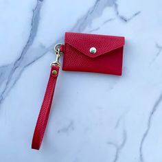 Crafted with premium Italian Pebble Grain Leather, this minimalist envelope wristlet is the perfect accessory for beautiful simplicity. Toss it in a bag or just wear out alone with as a no fuss, classically designed accessory. SHIPS IN 7-10 BUSINESS DAYS SPECS Dimensions: 3”H x 4.5”W Wristlet Strap: 6" opening, 8" including hardware Solid Brass D-Ring, Bolt Snap and Snap closure Lined with Leather Hand Painted edges FABRIC CARE Spot clean. ADDITIONAL FEATURES Holds up to 8 cards Detachable strap Classic Clutch Wristlet For Everyday Use, Elegant Wristlet For Daily Use, Minimalist Rectangular Clutch As Gift, Classic Everyday Wristlet With Wrist Strap, Elegant Wristlet With Removable Pouch For Everyday, Chic Rectangular Wristlet For Gift, Elegant Everyday Wristlet With Removable Pouch, Classic Everyday Clutch Wristlet, Elegant Everyday Clutch