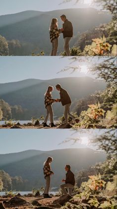 two people standing on top of a mountain next to each other