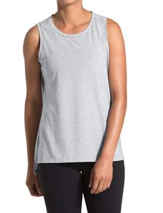 The North Face Emerine Tank is ideal not only for casual summer days but also for workouts, hiking, and so much more. Color: Solid light grey. Material: 100% Cotton. Center back chain stitch. Split side-seam detailing with drop hem. Logo flag label on lower-left side seam. Standard fit. Quick Drying. Back side length approx. 27 in. front side approx. 25 in. Care: Machine wash cold. Tumble dry low. We'll be happy to answer any questions you may have.   ALL ITEMS COME FROM CLEAN, SMOKE FREE / PET Back Chain, Casual Summer Tops, Grey Material, Sell Online, North Face Women, Chain Stitch, Active Wear Tops, Summer Top, Selling Online