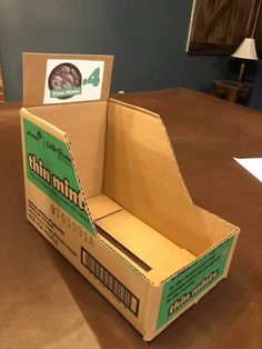 an open cardboard box sitting on top of a table