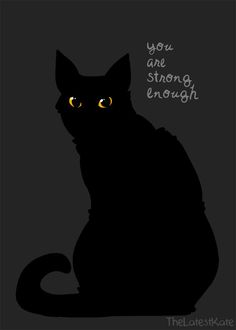 a black cat sitting in the dark with an inscription on it that says you are strong enough