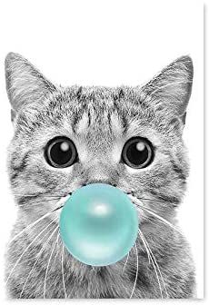 a black and white photo of a cat with a pink bubble in its mouth