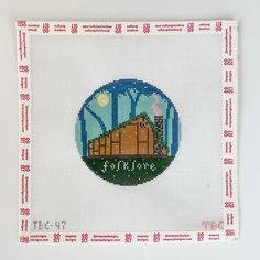 there is a cross stitch picture with the name fortale on it and trees in the background