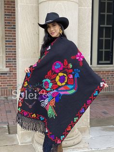 This Beautiful Hand Embroidered Blanket Shawl is perfect for keeping you warm and stylish at the same time. It has gorgeous hand embroidered details from top to bottom. This Shawl is handmade by Mexican Artisans and is completely one of a kind. Note: This Shawl comes in one size which is ideal for sizes Extra Small, Small, Medium, Large, Extra Large, 2x, 3x. Mexican Color Scarf, Embroidered Black Shawl For Fall, Black Embroidered Shawl For Fall, Winter Embroidered Multicolor Shawl, Embroidered One Size Winter Shawl, One Size Embroidered Winter Shawl, Embroidered Folk Shawl One Size, Traditional Multicolor Embroidered Shawl For Winter, One Size Embroidered Folk Shawl