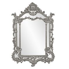 an ornate silver mirror on a white background