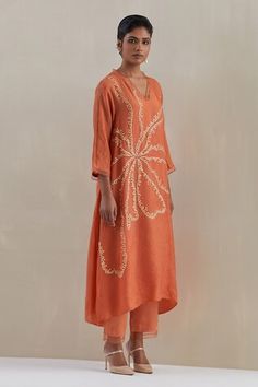 Orange kaftan hand embroidered with flower motif, asymmetric hem and sheer scalloped border detailing on neck and cuffs. Paired with a flared pant with sheer border on hem and contrasting line on sides. - Aza Fashions Festive V-neck Kaftan With Floral Embroidery, Bohemian Embellished Kurta For Spring, Spring Bohemian Embellished Kurta, Festive Summer Kurta With Embroidered Hem, V-neck Kurta With Floral Embroidery For Spring, Spring V-neck Kurta With Floral Embroidery, Floral Embroidery V-neck Kurta For Spring, Summer Silk V-neck Kurta, V-neck Tunic With Resham Embroidery