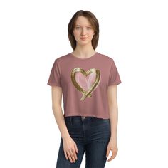 Equipped with a flowy fit for easy-going appearances, this women’s tee features a tailored sleeve along with a modest fit. Made with 65%/35% polyester/viscose fabric for stretchiness and equipped with a tear-away label for a scratch-free experience. .: 65% polyester, 35% viscose (fiber content may vary for different colors).: Light fabric (3.7 oz/yd² (125 g/m²)).: Flowy fit.: Modest crop.: Tear-away label S M L XL 2XL Width, in 18.75 19.87 21.87 23.87 25.87 Length, in 18.37 19.12 19.87 20.62 21.37 Spring Heart Graphic T-shirt, Casual Fitted Gold T-shirt, Gold Short Sleeve Tops For Spring, Modest Fits, Heart Women, Chic Pink, Feather Light, Cropped Tee, Easy Going