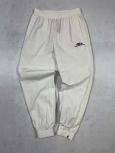 Vintage Fila Pants, Pre-owned Pants, White Cuffed Pants, WomensTrack Pants, Womens Clothing - Women's Medium Size On Label: Medium Recommended Size: Women's Medium Measurements: Waist: 14" - 16" Inseam: 28" *Very minor signs of wear present, please check additional picture(s) for more info Womens Track Pants, Indian Pants, Tango Pants, Fila Vintage, Track Pants Women, Pants Sewing Pattern, Womens Trousers, Turkish Fashion, Cuffed Pants