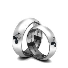 two wedding rings with mickey mouse designs on them