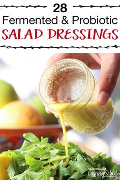 salad dressing being poured into a bowl with lettuce and lemons in the background