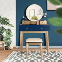 a black vanity with mirror and stool in front of a blue wall on a rug