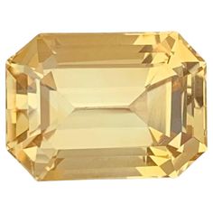 an orange and yellow colored diamond on a white background with the top half cut off