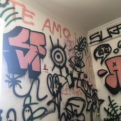 some graffiti on the wall in a room